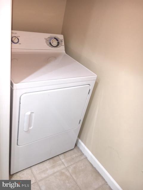 502 Sunset View Terrace Southeast, Unit 302 Leesburg, VA 20175 - Photo 18 of 50 Full-sized washer/dryer closet in kitchen area.