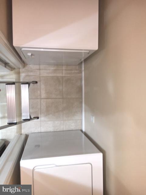 502 Sunset View Terrace Southeast, Unit 302 Leesburg, VA 20175 - Photo 20 of 50 Full-sized washer/dryer closet in kitchen area.