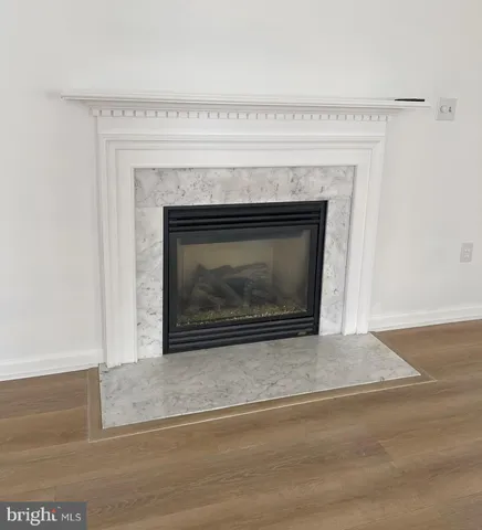 a kitchen with stainless steel appliances granite countertop a sink dishwasher a stove and a refrigerator