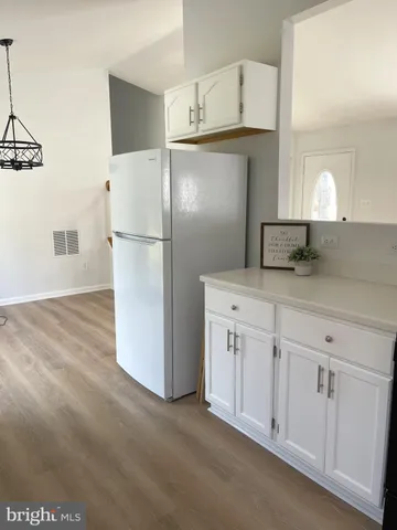 a kitchen with a stove and a microwave