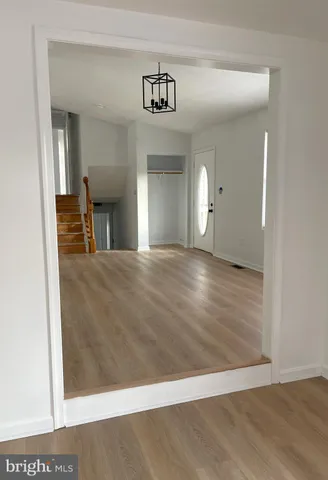 a bathroom with a toilet a sink and a mirror