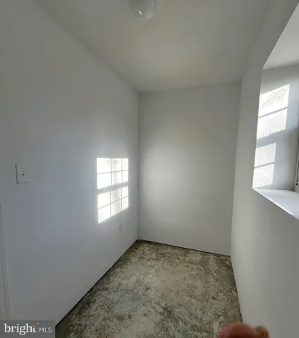 a park with water fountain in front of it