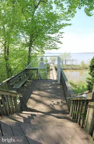 a view of a swimming pool with a yard