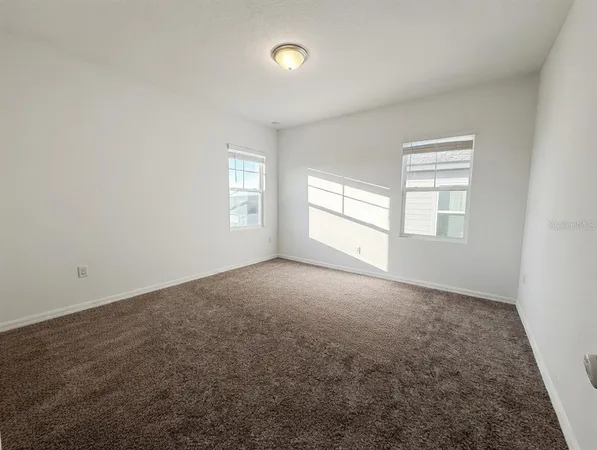 an empty room with windows