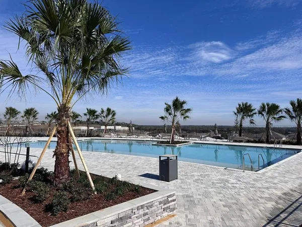 a view of a swimming pool and a chair