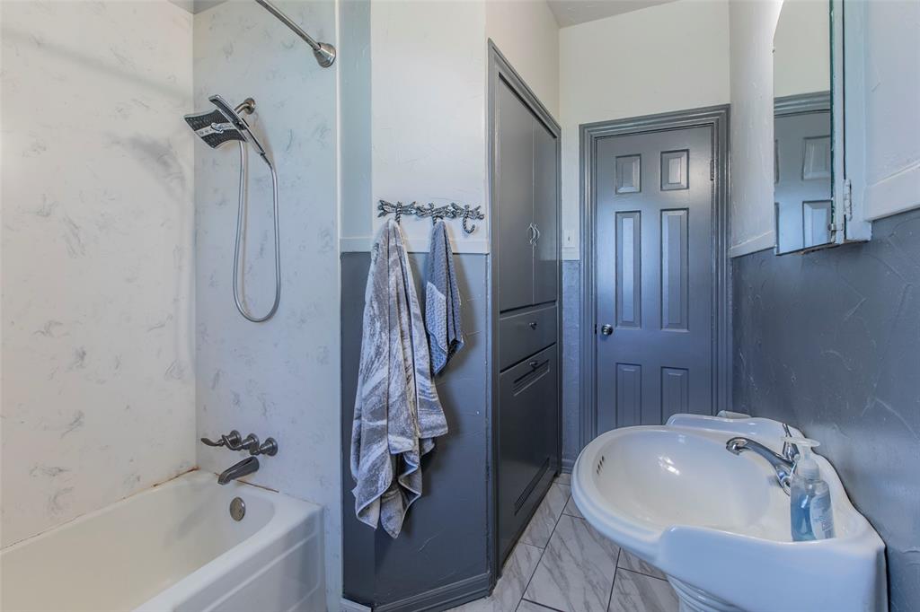 2603 Pine Avenue Waco, TX 76708 - Photo 15 of 23 a bathroom with a tub sink and shower