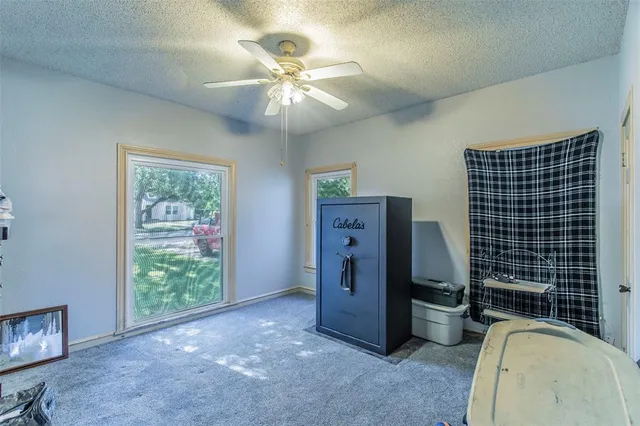 a view of livingroom with furniture and chandelier fan