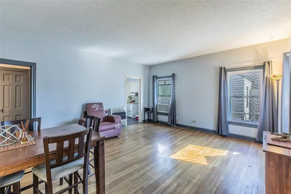 a view of a livingroom with furniture and wooden floor