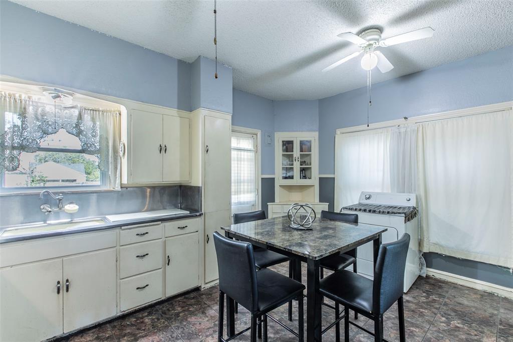 2603 Pine Avenue Waco, TX 76708 - Photo 10 of 23 a kitchen with a table chairs and cabinets