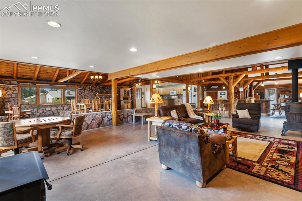 1100 Rampart Range Road Woodland Park, CO 80863 - Photo 11 of 50 Cozy cabin elements create an inviting atmosphere to entertain, relax, or spend time with loved ones