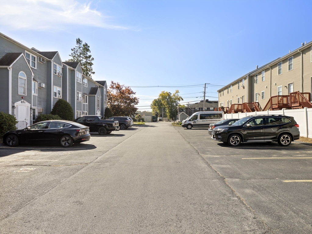 1821 Middlesex Street, Unit 10 Lowell, MA 01851 - Photo 16 of 26 a view of cars parked in front of a building