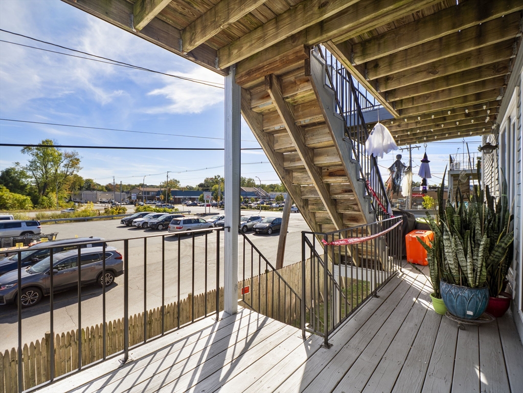 1821 Middlesex Street, Unit 10 Lowell, MA 01851 - Photo 20 of 26 a view of a balcony with furniture
