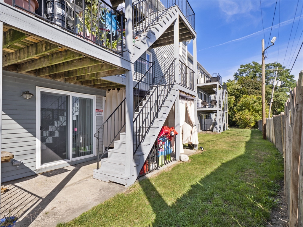 1821 Middlesex Street, Unit 10 Lowell, MA 01851 - Photo 22 of 26 a view of a house with a yard