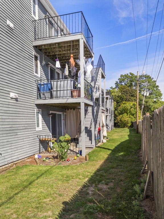 1821 Middlesex Street, Unit 10 Lowell, MA 01851 - Photo 25 of 26 a view of a chair and table in backyard of the house
