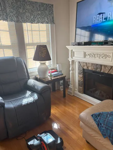 a living room with furniture and a fireplace