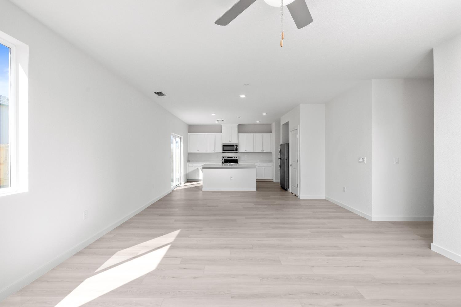 929 South Mylea Court Stockton, CA 95215 - Photo 4 of 8 a view of a kitchen with wooden floor