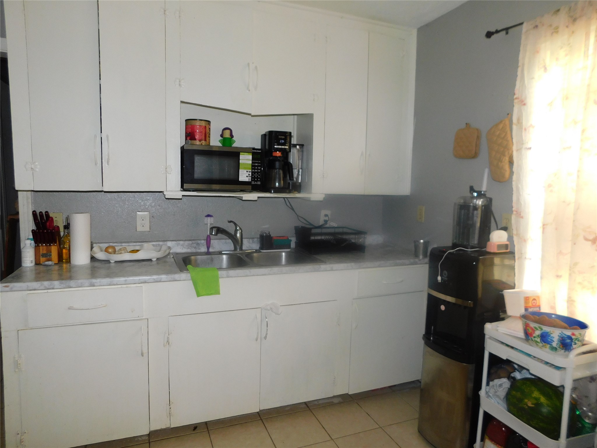1716 Roxella Street Houston, TX 77093 - Photo 5 of 14 a kitchen with sink cabinets and appliances