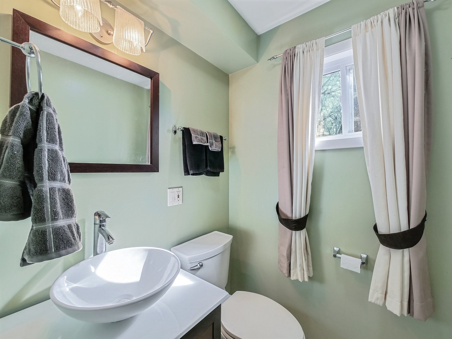 1903 Hopi Lane Mount Prospect, IL 60056 - Photo 10 of 36 a bathroom with a toilet sink and mirror