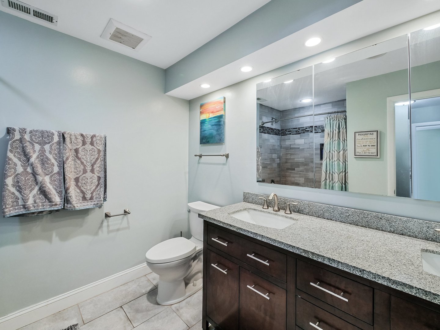 1903 Hopi Lane Mount Prospect, IL 60056 - Photo 14 of 36 a bathroom with a granite countertop sink a toilet and a mirror