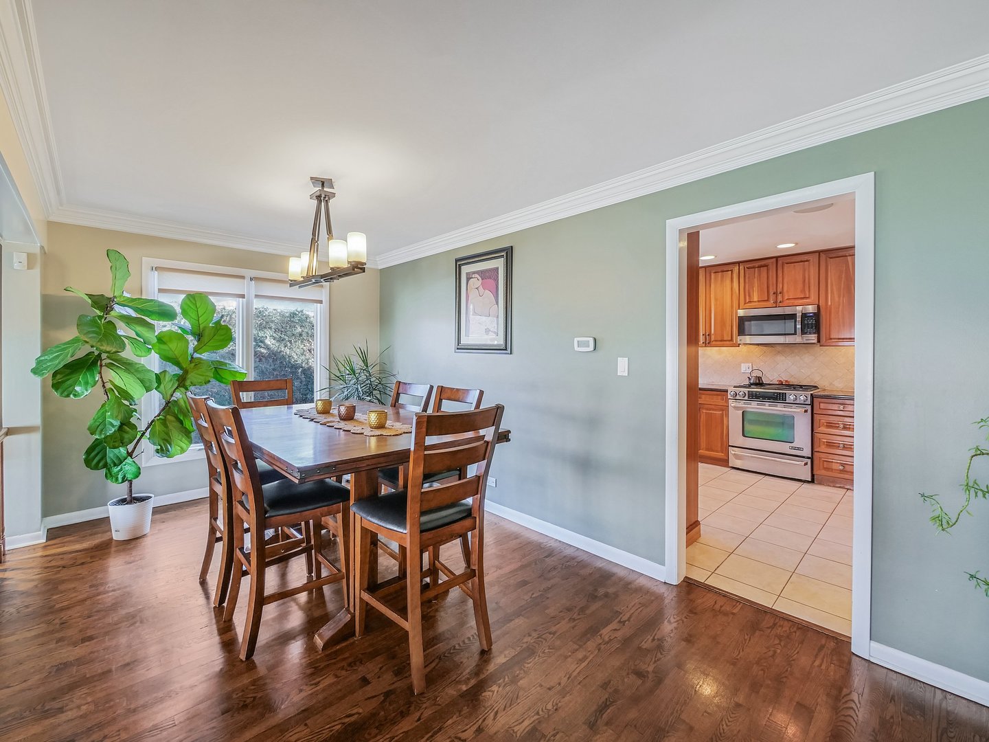 1903 Hopi Lane Mount Prospect, IL 60056 - Photo 2 of 36 a view of a dining room with furniture and wooden floor