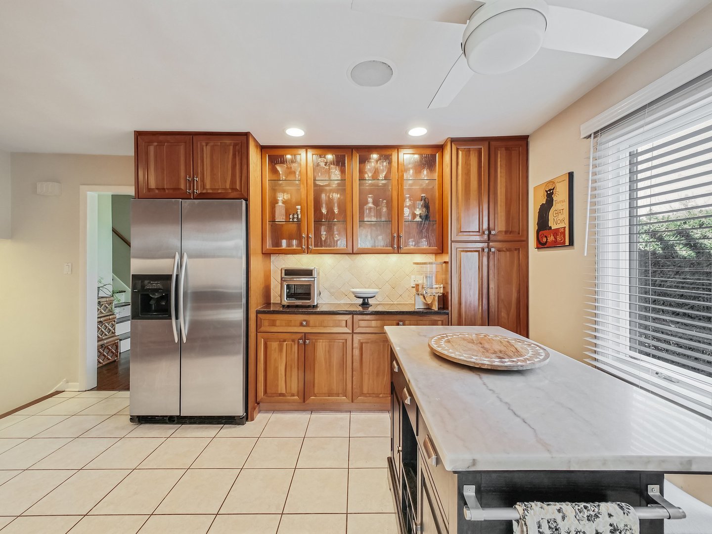 1903 Hopi Lane Mount Prospect, IL 60056 - Photo 4 of 36 a kitchen with granite countertop a refrigerator and a sink