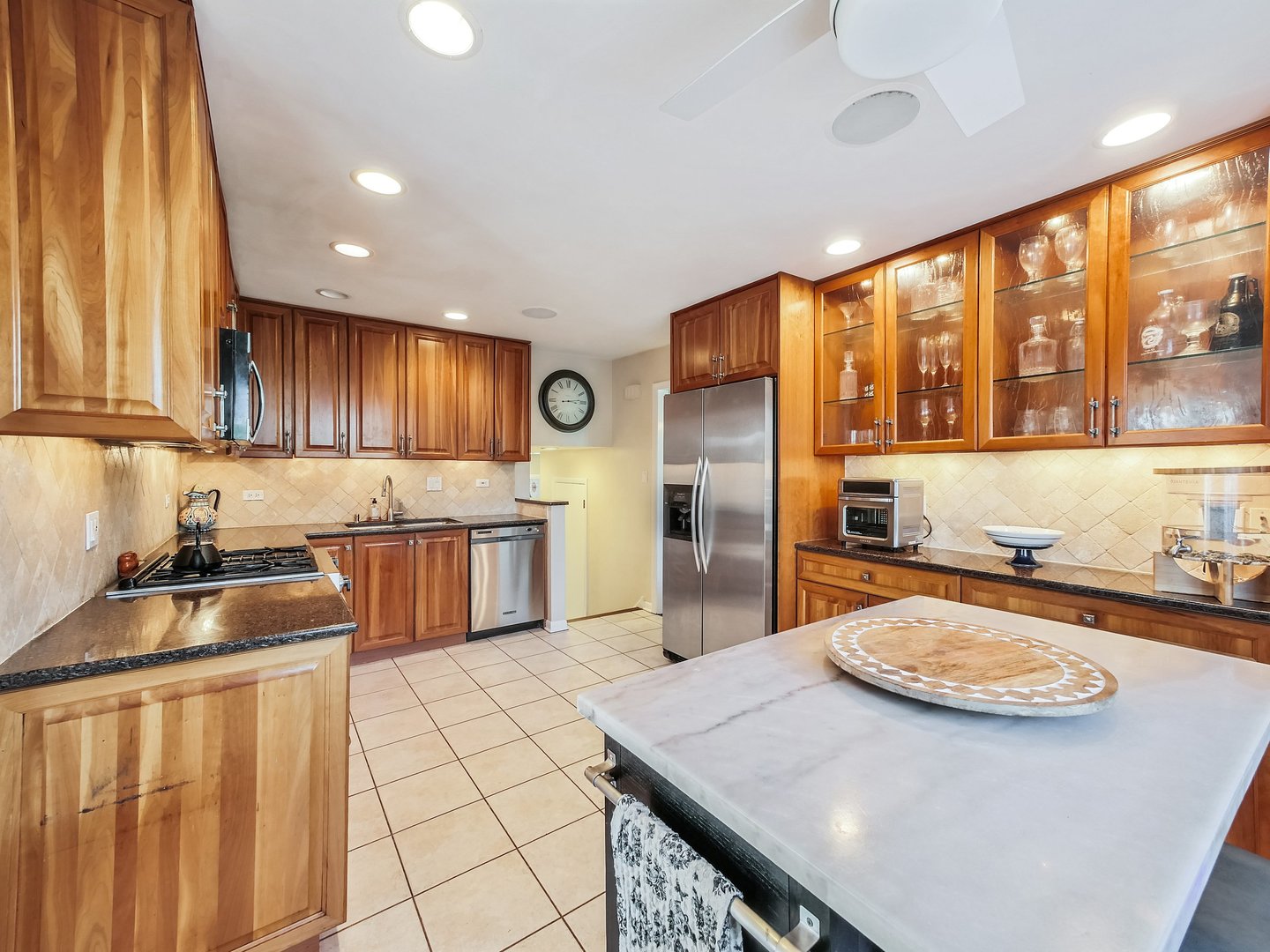 1903 Hopi Lane Mount Prospect, IL 60056 - Photo 5 of 36 a kitchen with stainless steel appliances granite countertop a sink a stove and a refrigerator