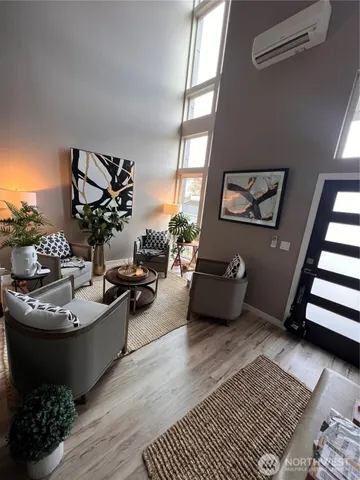 a living room with furniture and a rug