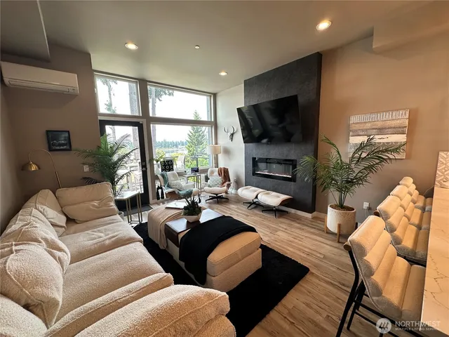 a living room with furniture fireplace and a flat screen tv