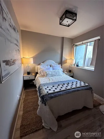 a bedroom with a bed and window