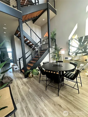 a view of a dining room with furniture and wooden floor