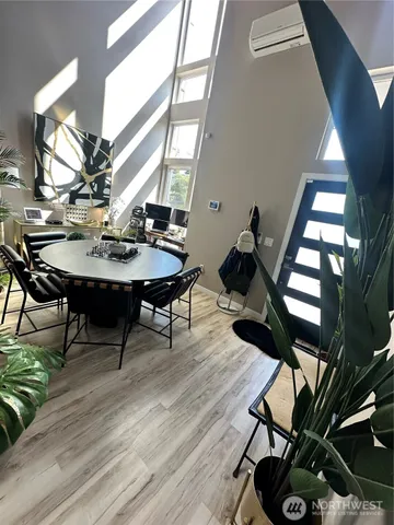 a view of a livingroom with furniture and a window
