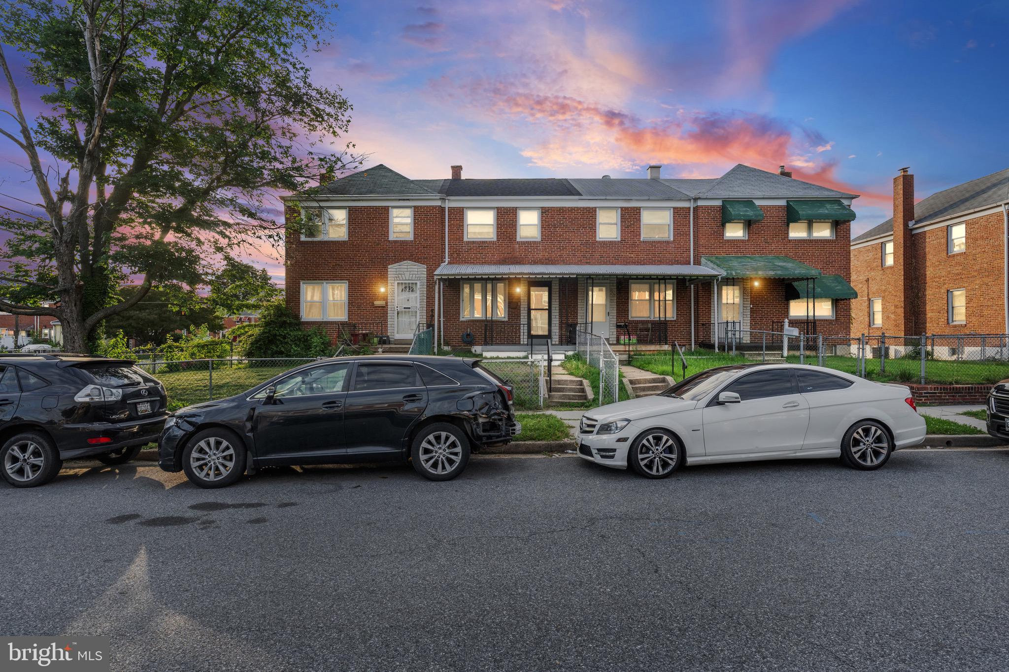 a car parked in front of a house