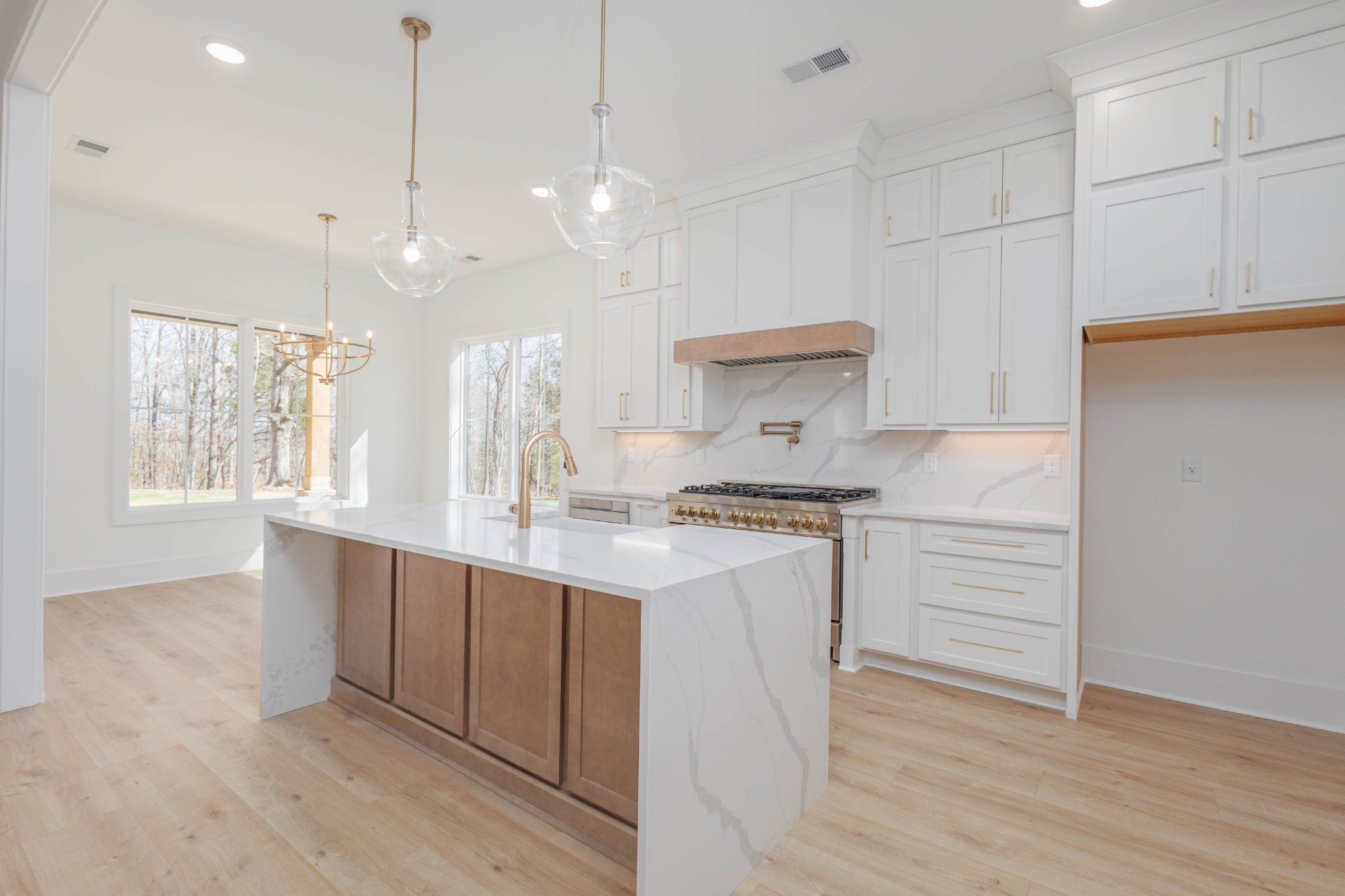 7771 Barnhill Road Primm Springs, TN 38476 - Photo 14 of 61 a kitchen with kitchen island a sink stainless steel appliances and cabinets