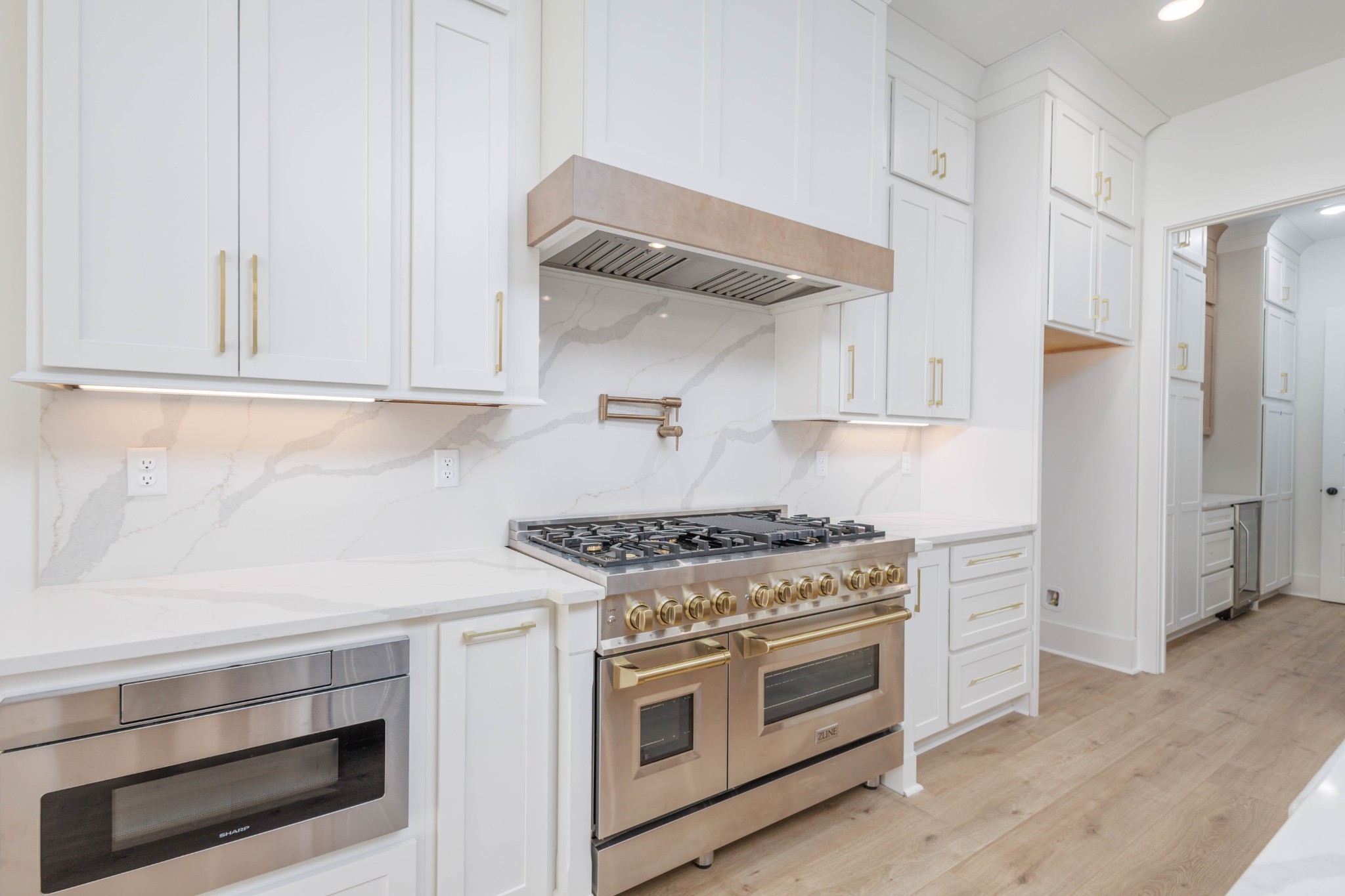 7771 Barnhill Road Primm Springs, TN 38476 - Photo 18 of 61 a kitchen with white cabinets and a stove