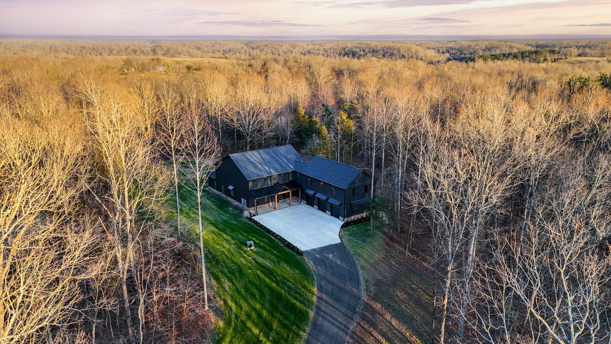 7771 Barnhill Road Primm Springs, TN 38476 - Photo 2 of 61 a view of a lake with a mountain view