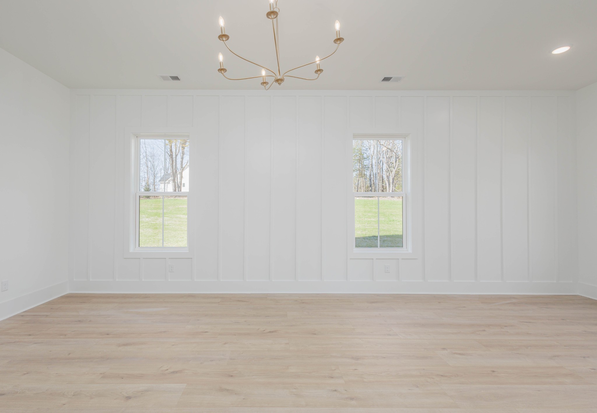 7771 Barnhill Road Primm Springs, TN 38476 - Photo 30 of 61 an empty room with wooden floor and windows