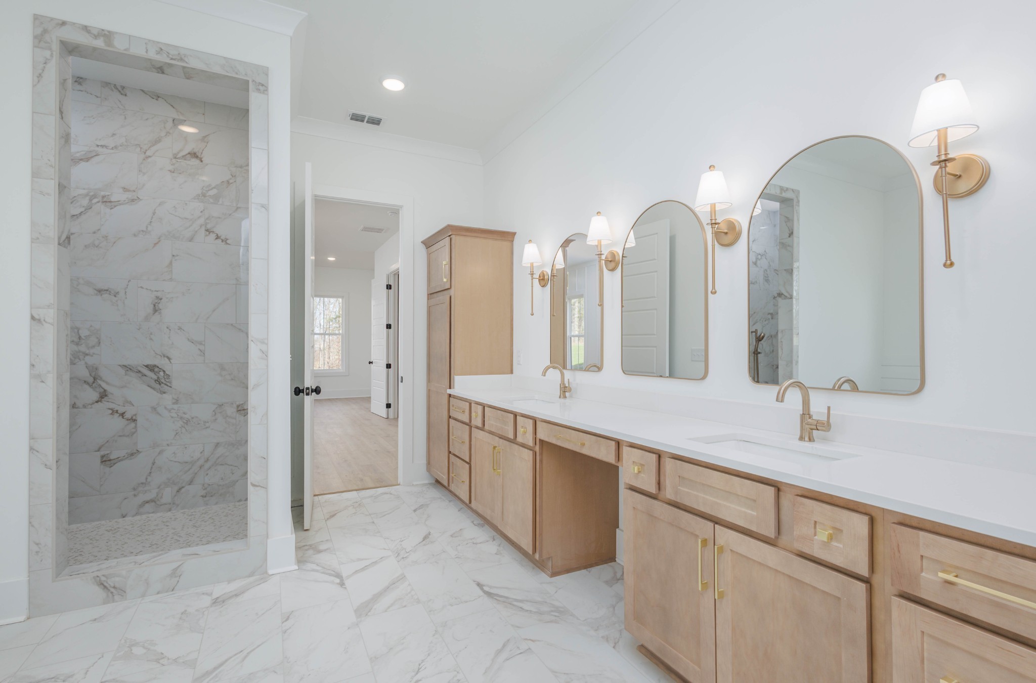 7771 Barnhill Road Primm Springs, TN 38476 - Photo 33 of 61 a spacious bathroom with a double vanity sink mirror and shower
