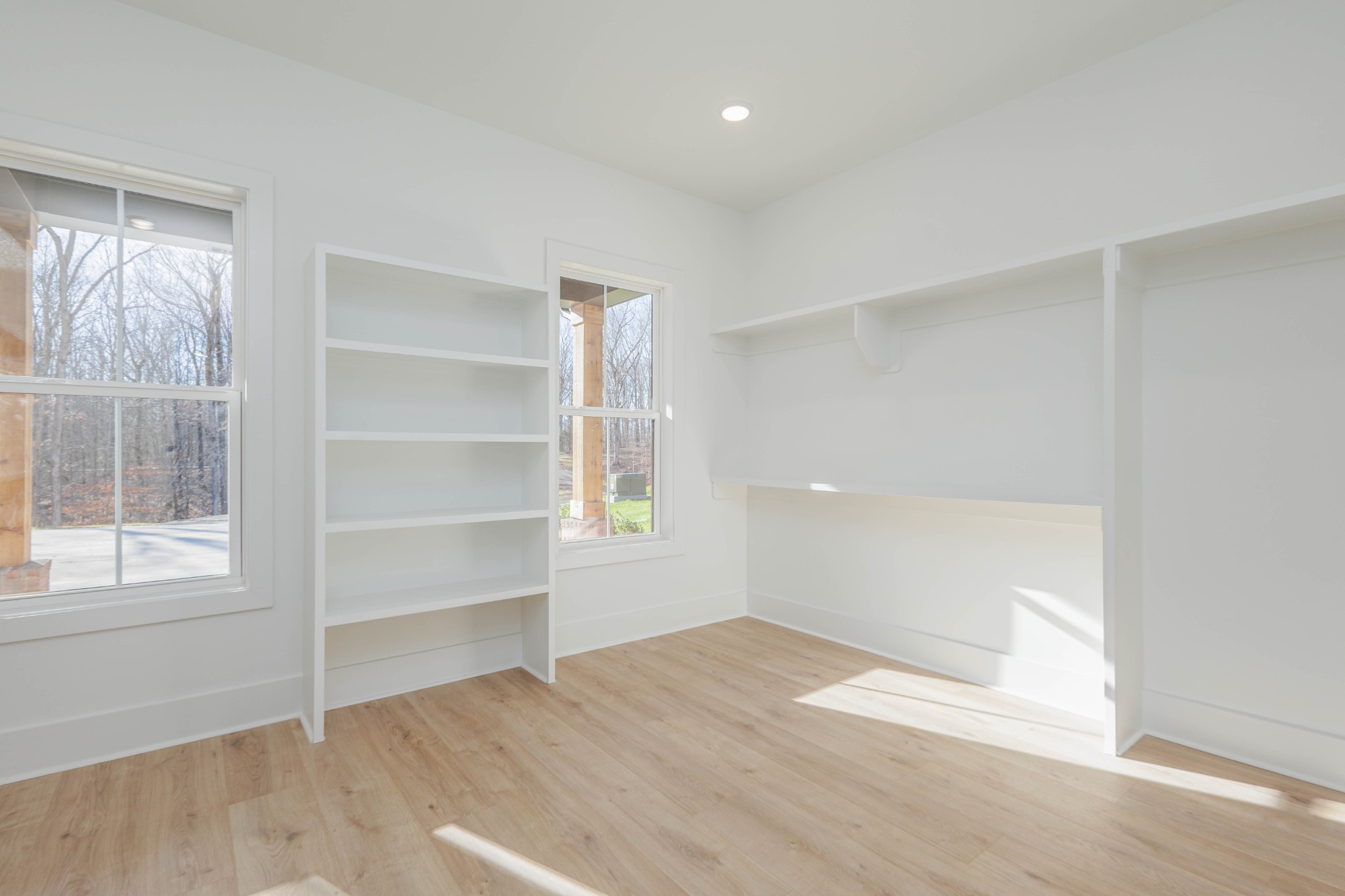 7771 Barnhill Road Primm Springs, TN 38476 - Photo 36 of 61 a view of an empty room with a window and wooden floor
