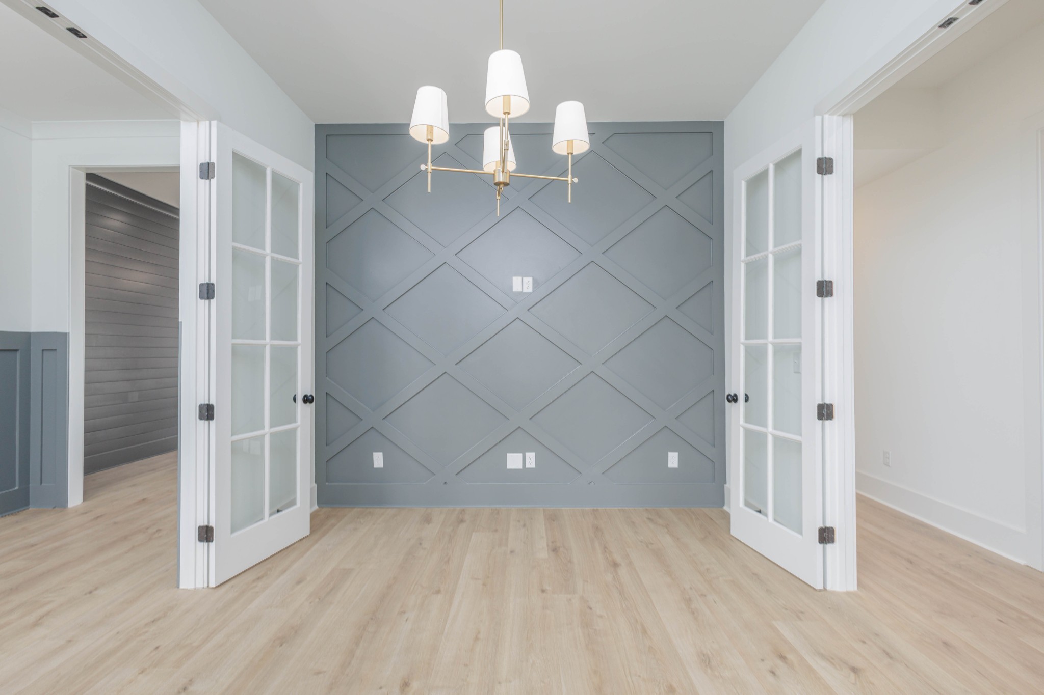 7771 Barnhill Road Primm Springs, TN 38476 - Photo 39 of 61 an empty room with wooden floor and staircase