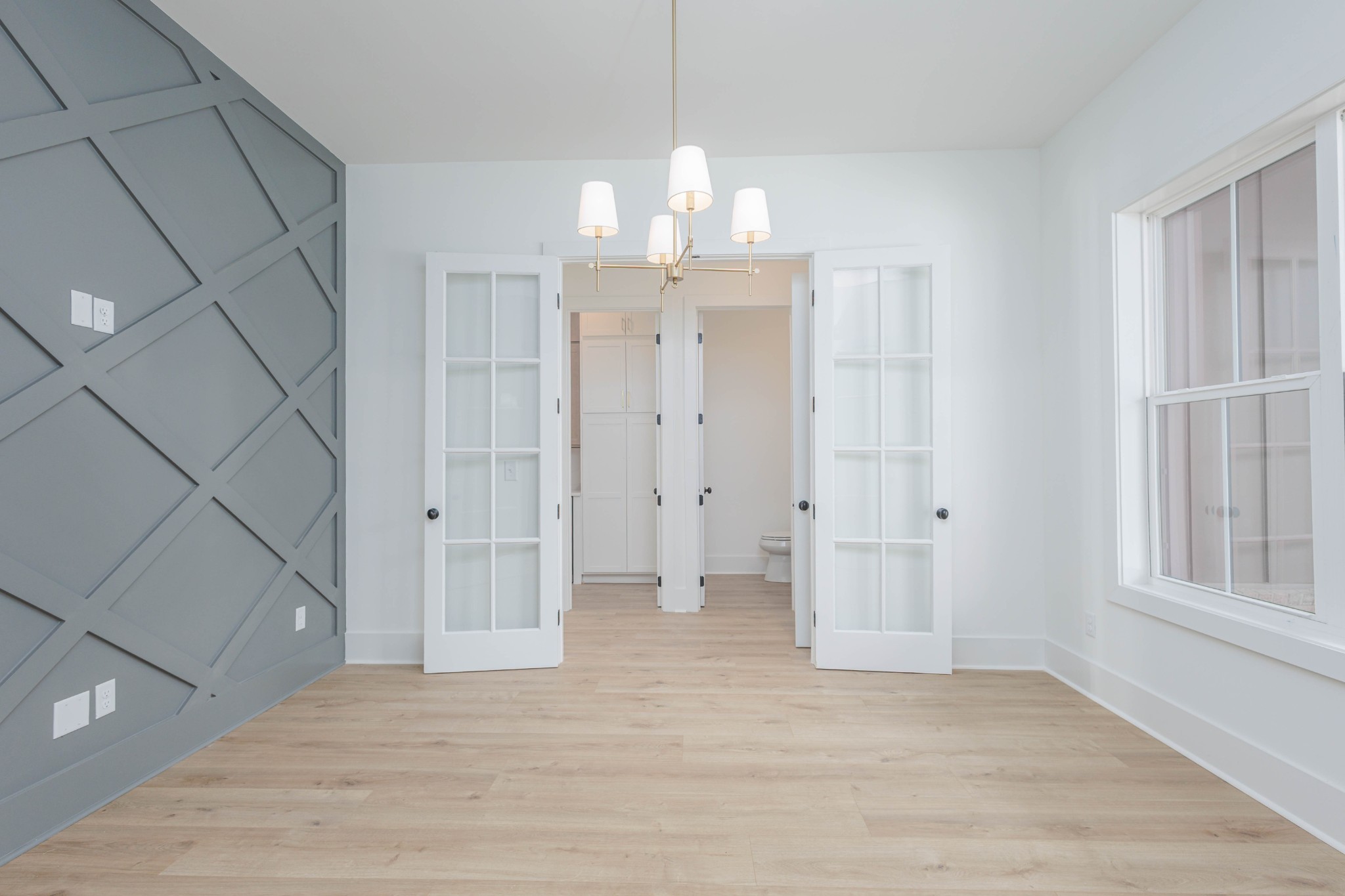 7771 Barnhill Road Primm Springs, TN 38476 - Photo 41 of 61 a view of a room with wooden floor and windows