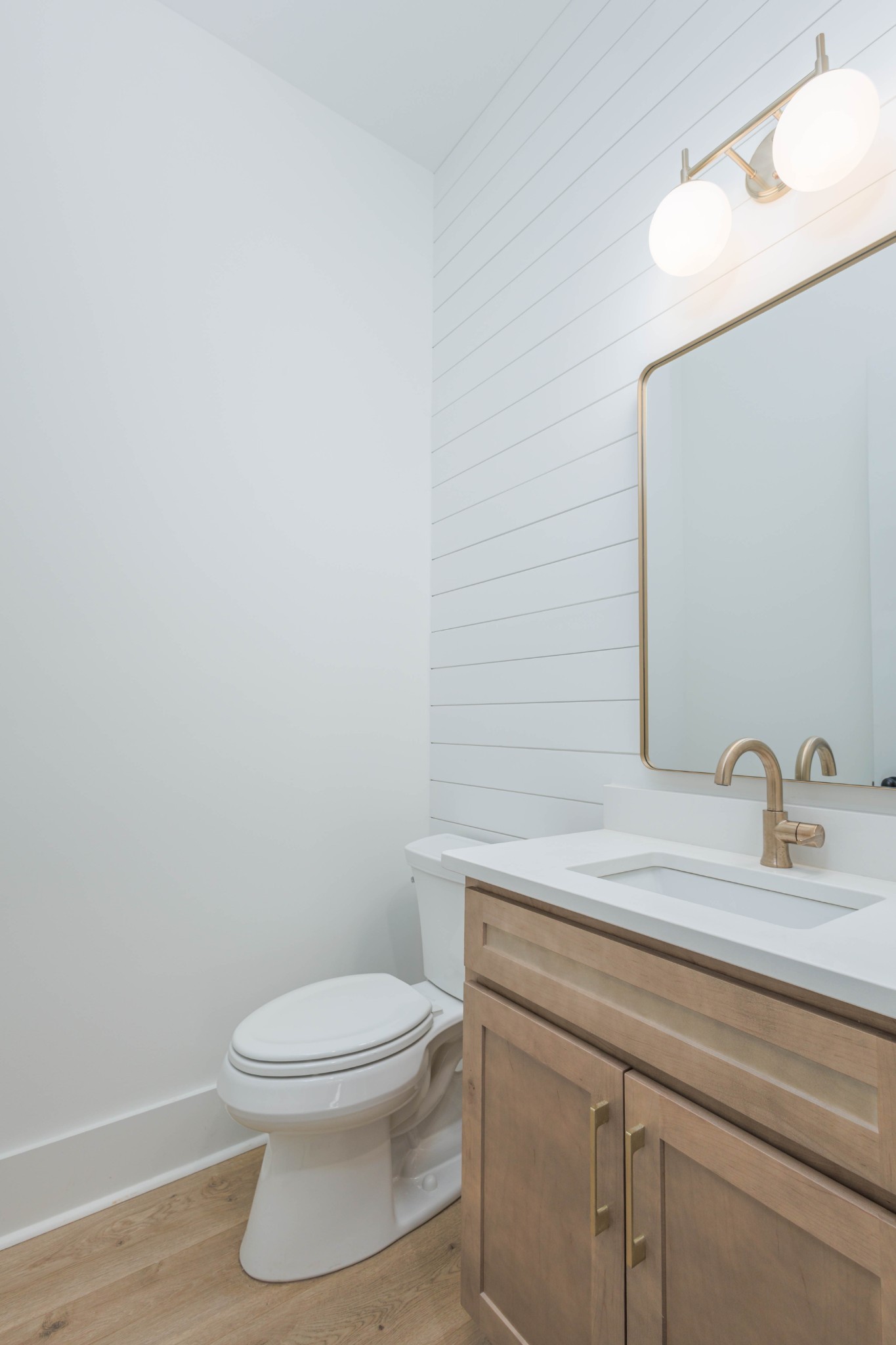 7771 Barnhill Road Primm Springs, TN 38476 - Photo 42 of 61 a bathroom with a toilet a sink and mirror