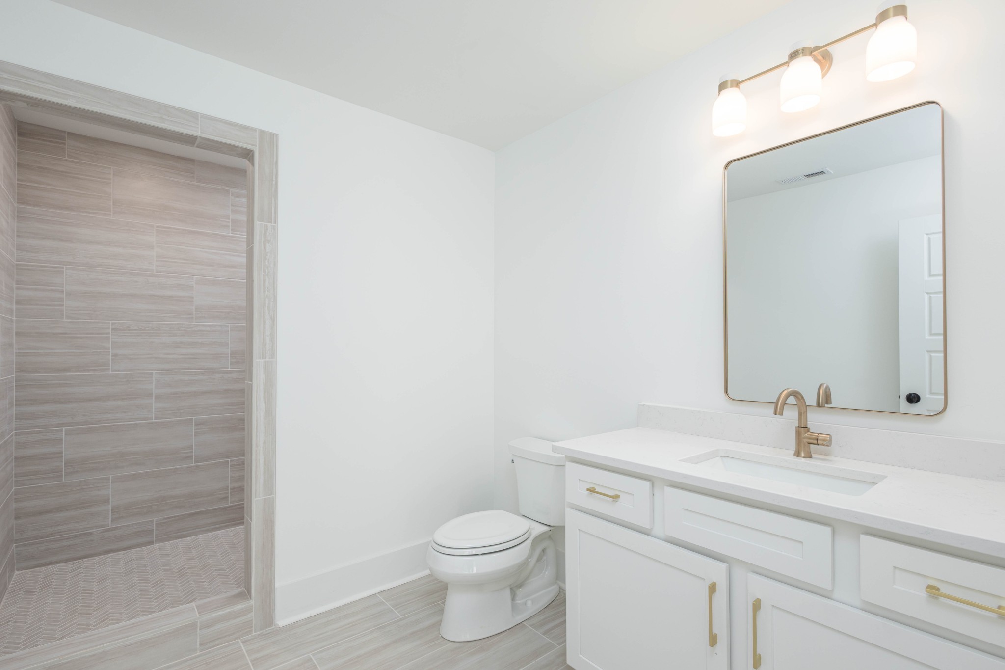 7771 Barnhill Road Primm Springs, TN 38476 - Photo 49 of 61 a bathroom with a sink a toilet and shower