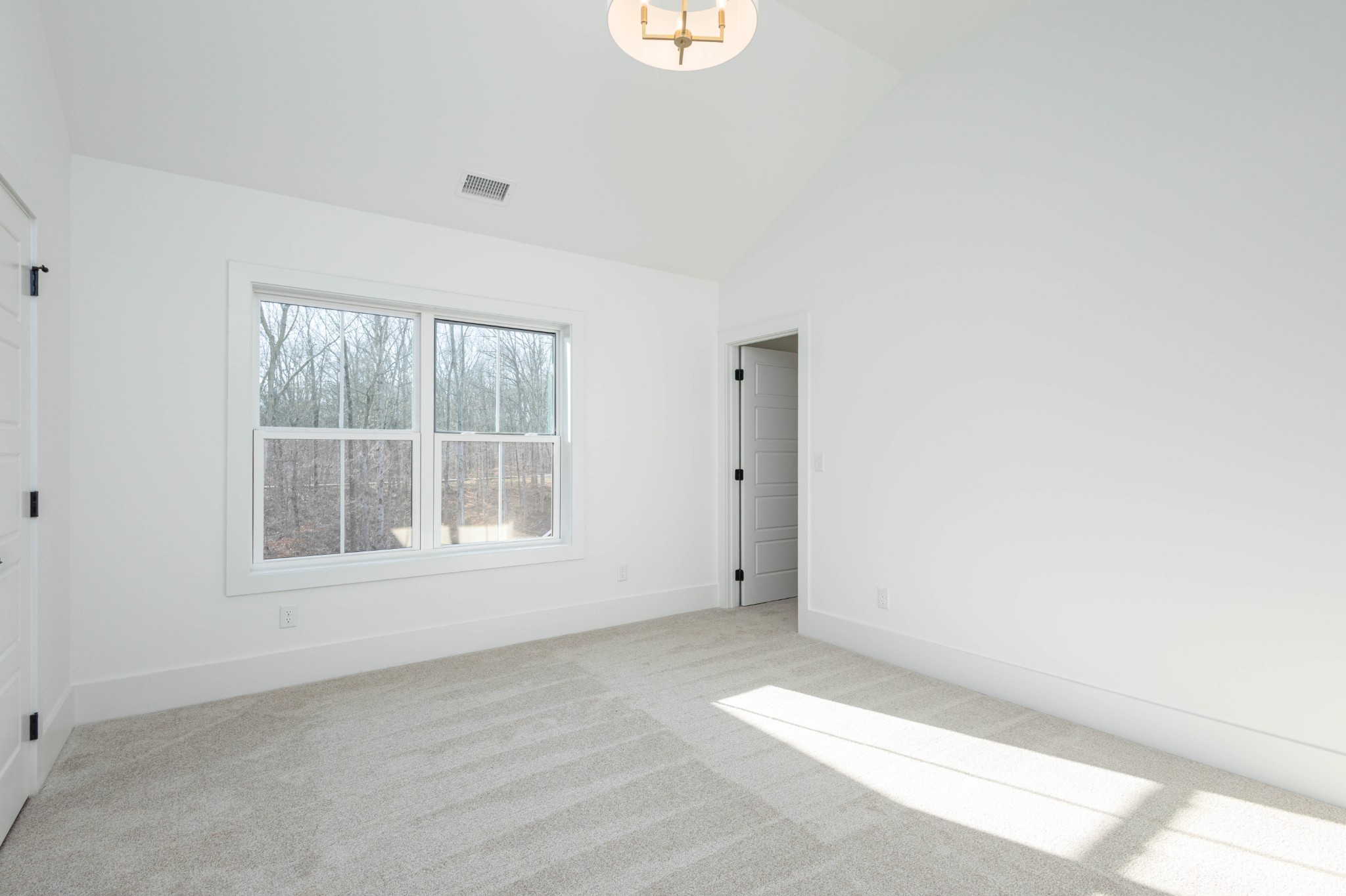 7771 Barnhill Road Primm Springs, TN 38476 - Photo 57 of 61 an empty room with a window