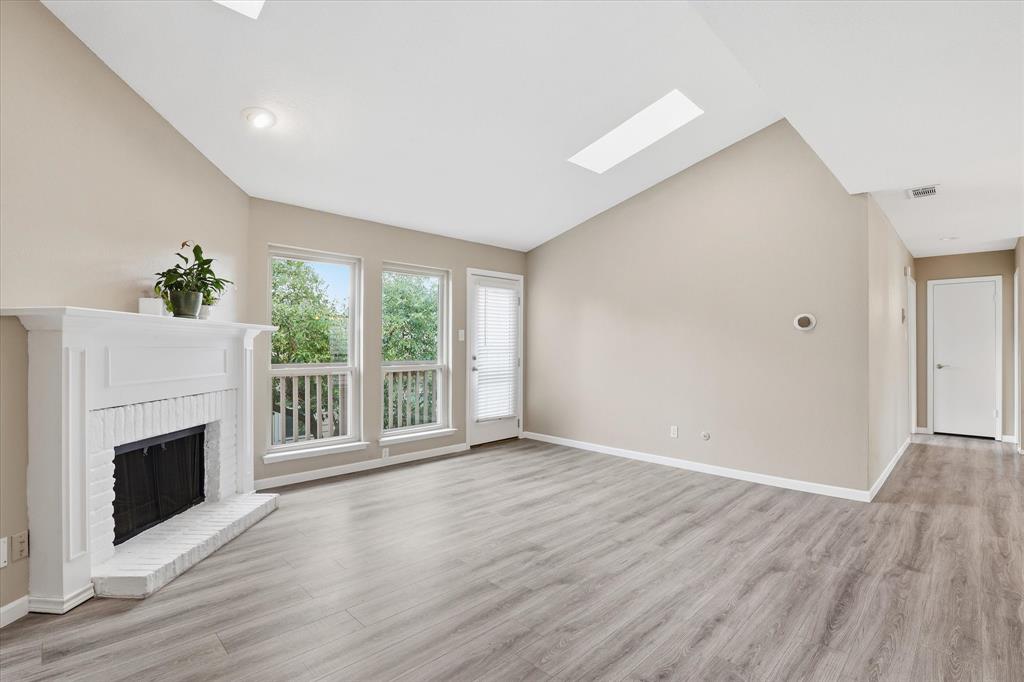 5616 Preston Oaks Road, Unit 404 Dallas, TX 75254 - Photo 1 of 34 Second floor condo with vaulted ceiling, skylights, and laminate flooring.