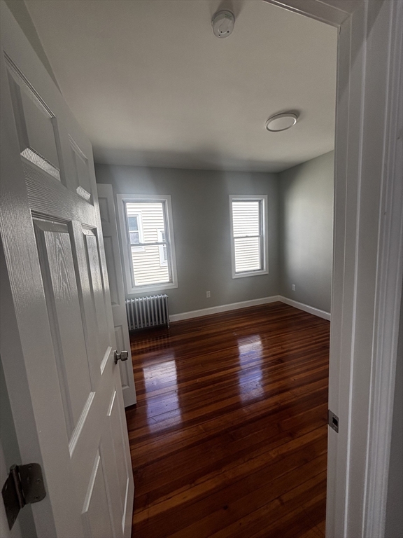 33 Wolcott Street, Unit 3 Boston, MA 02121 - Photo 7 of 8 a view of livingroom with hardwood floor and window