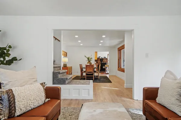a kitchen with granite countertop wooden cabinets stainless steel appliances and a window