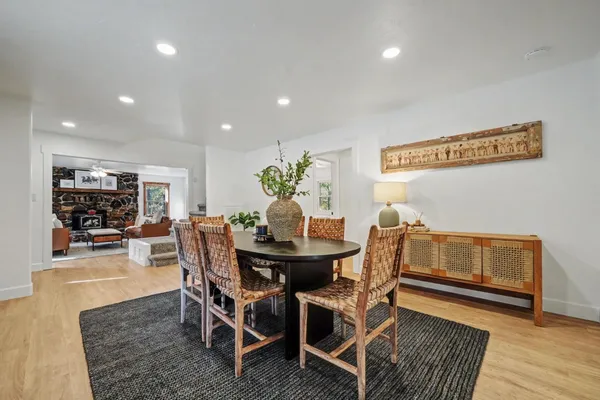 a bathroom with a granite countertop sink a vanity and shower