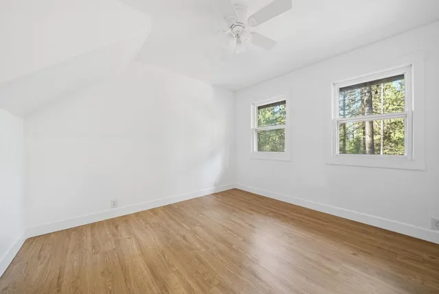 a view of an entryway with wooden floor