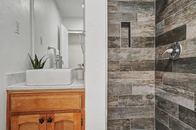 a view of an empty room and wooden floor