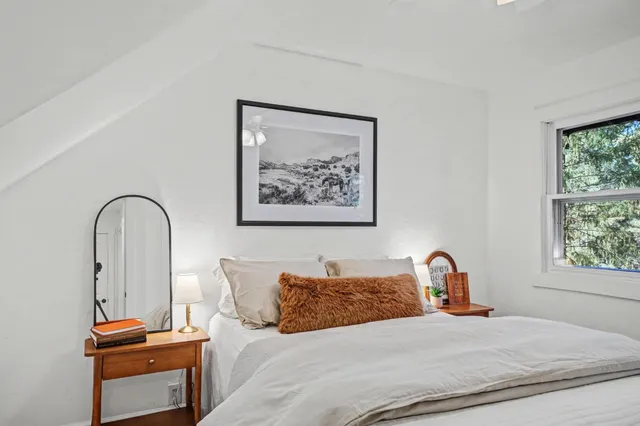 a view of a house with a yard next to a yard